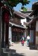 China: Naxi woman in a street in Lijiang Old Town, Yunnan Province